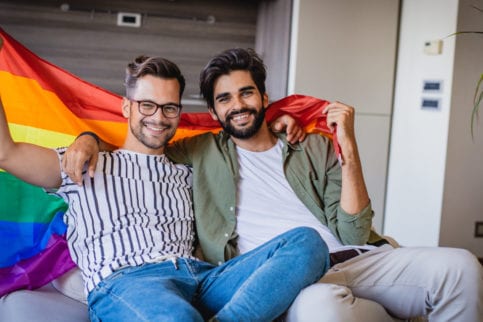 gay couple with pride flag