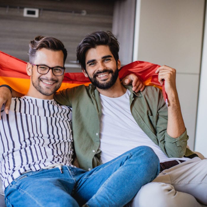 gay couple with pride flag