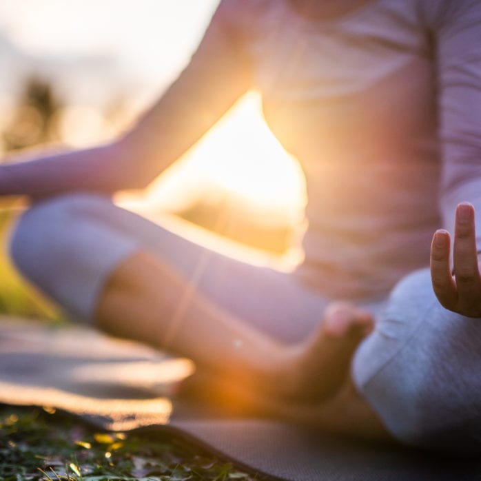 woman doing yoga pose outside