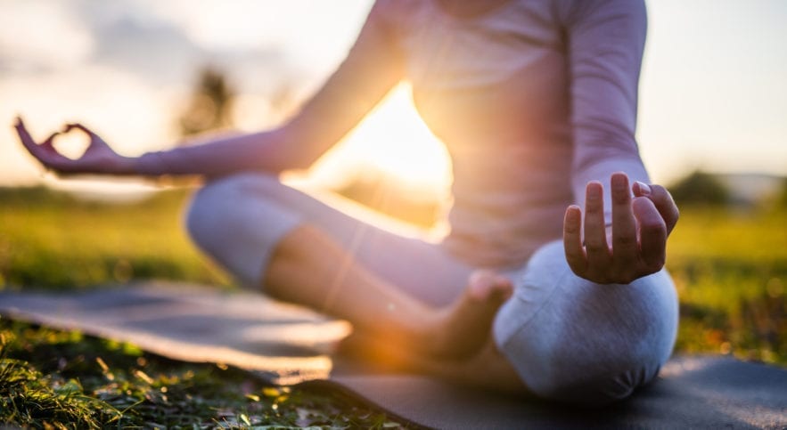 woman doing yoga pose outside