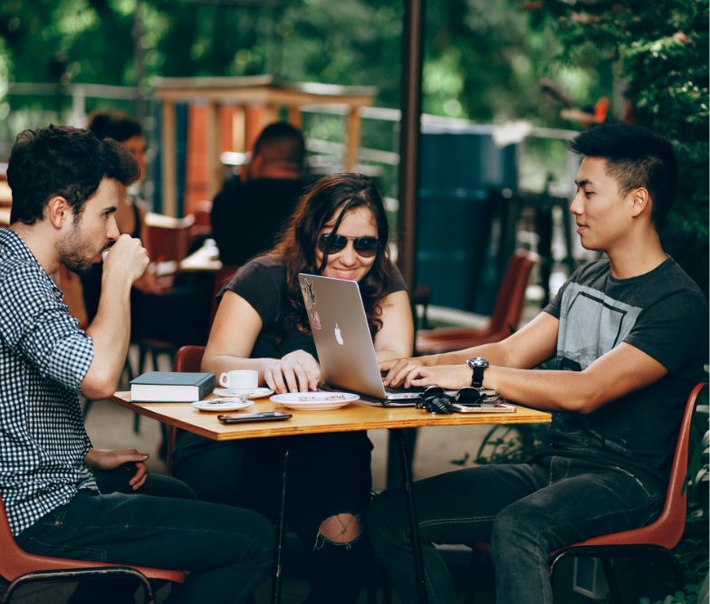 three students at a small table