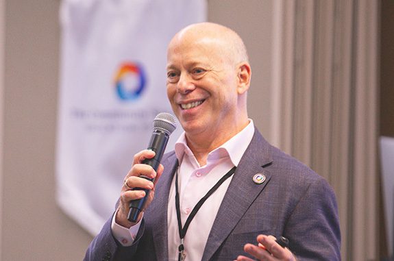 dr horowitz holding a microphone while giving a presentation